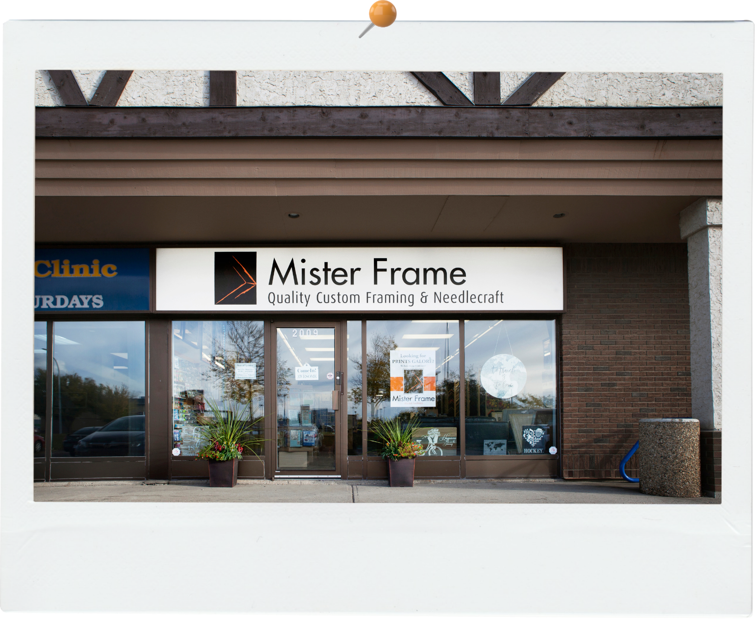 A picture of a mister frame store front