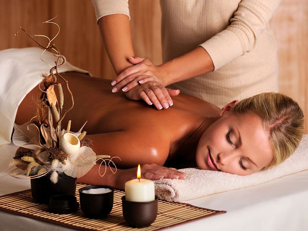 a woman getting a facial massage 
