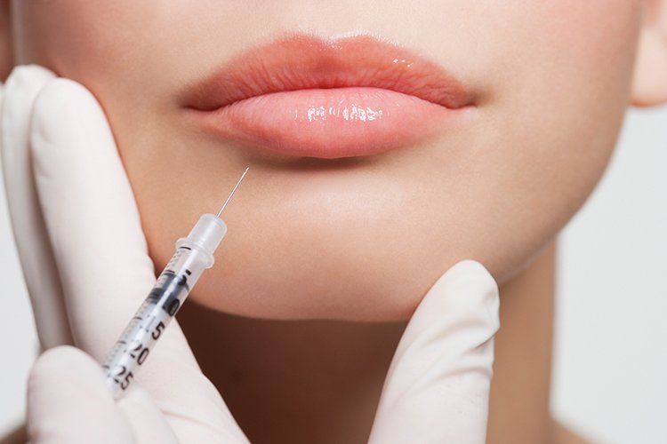 Receiving Botox Injection in Lips — Liberty, MO — Triplett Dental