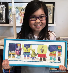 Art student showing finished drawing project