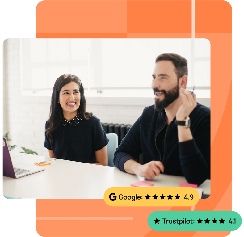 A group of people are sitting on a couch and a man is giving a presentation.