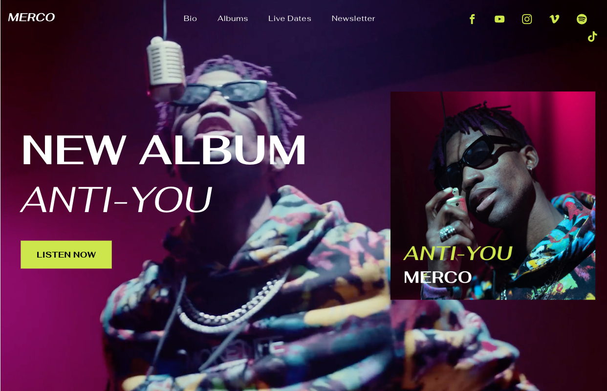 A man is singing into a microphone on a stage.