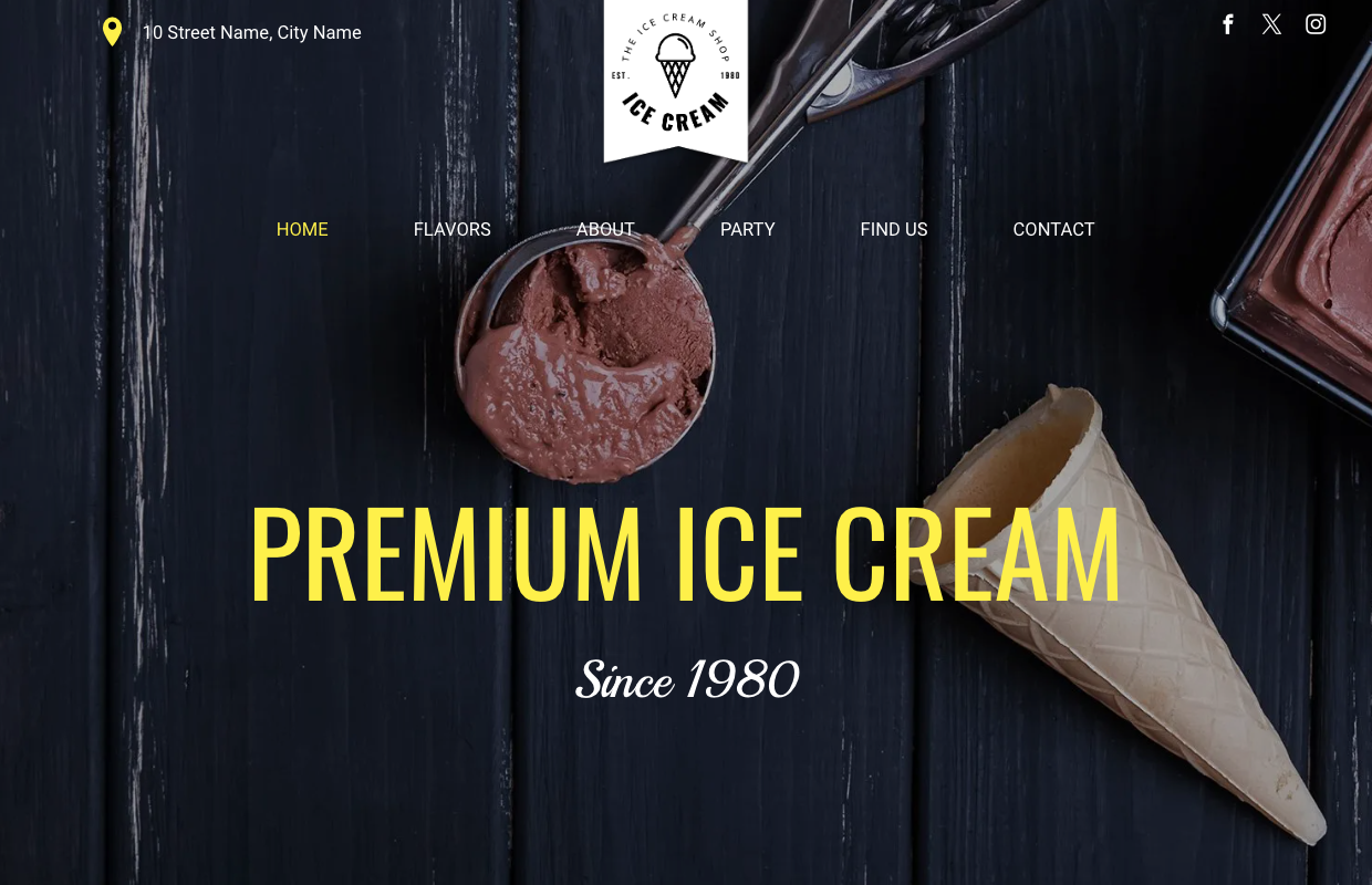 A scoop of chocolate ice cream next to a cone on a wooden table.