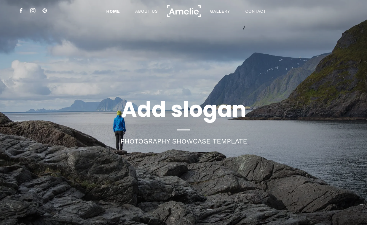 A person is standing on a rock near a body of water.