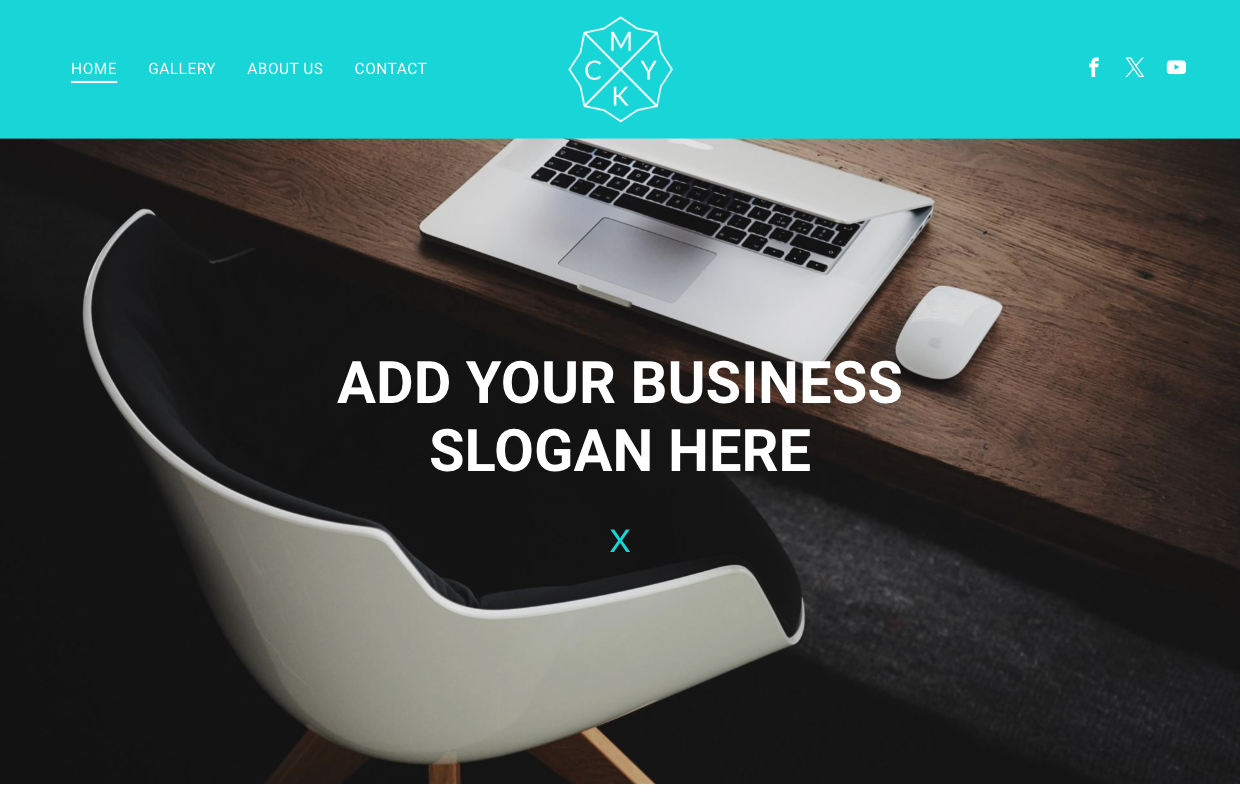 A laptop computer is sitting on a wooden desk next to a chair.