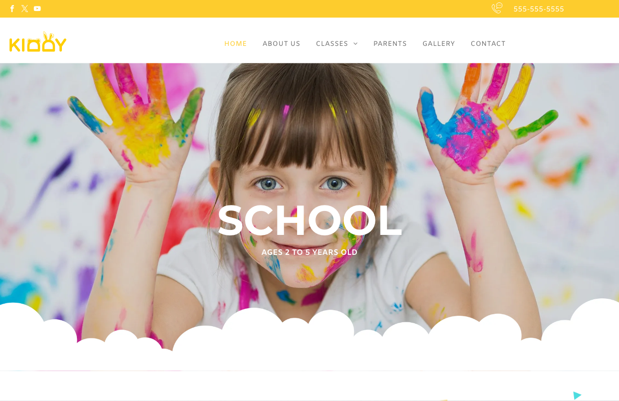 A little girl with her hands painted in different colors is on the school website.
