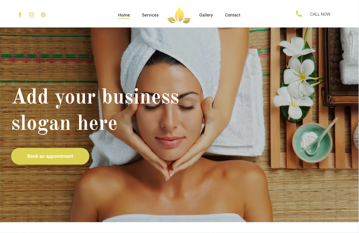 A woman with a towel wrapped around her head is getting a massage at a spa.