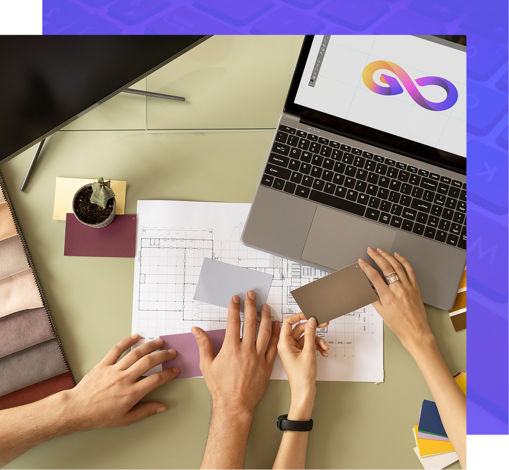 Hands on a table with a laptop, color swatches, and a blueprint, discussing design.