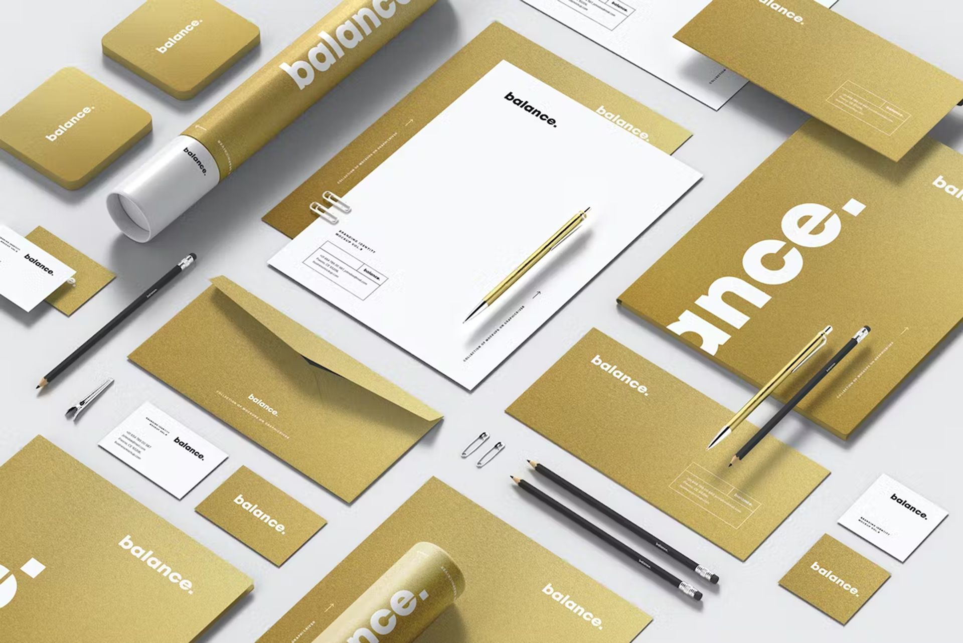 A mockup of a balance branded stationery set