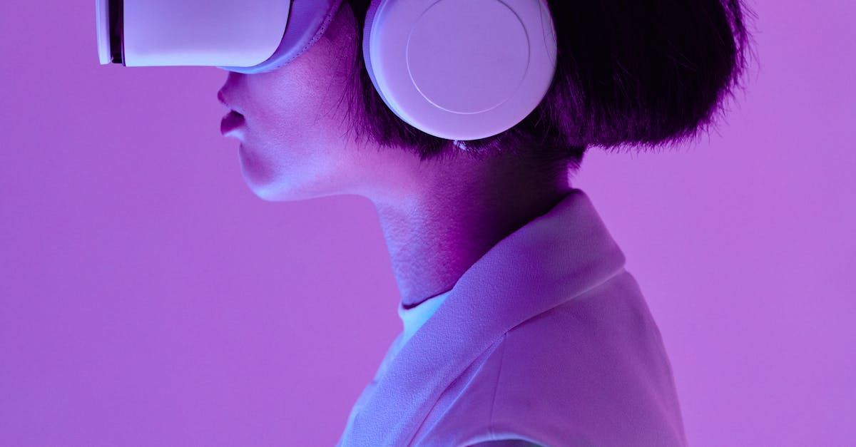 A woman is wearing a virtual reality headset and headphones.