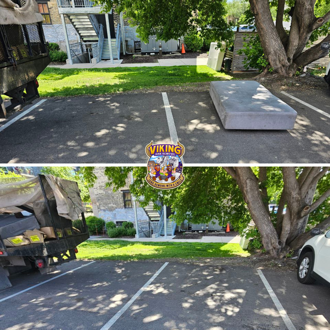 A truck is parked in a parking lot next to a tree.