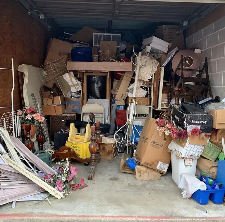 A garage filled with lots of boxes and flowers