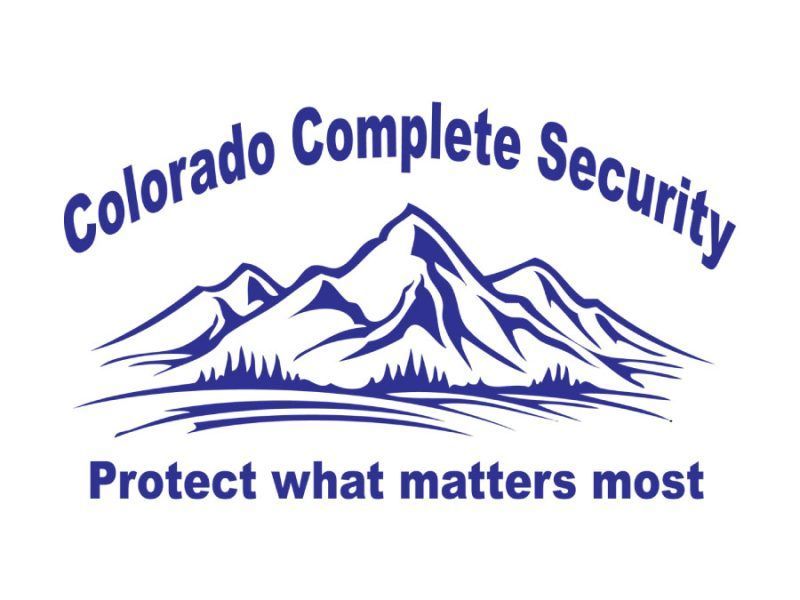 Blue logo for Colorado Complete Security featuring a mountain range above a forest and the text, 