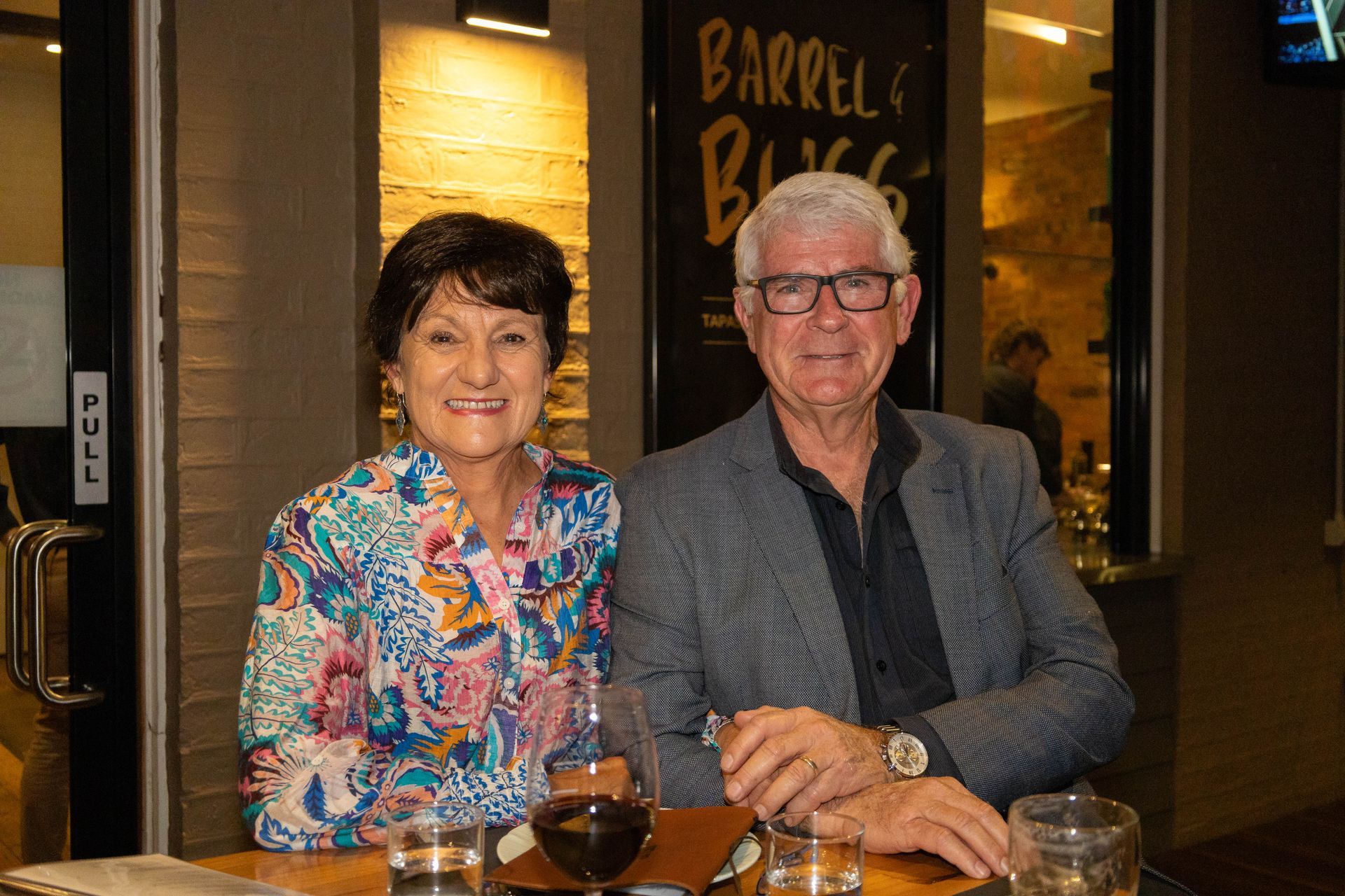 Smiling older couple at a table in 
