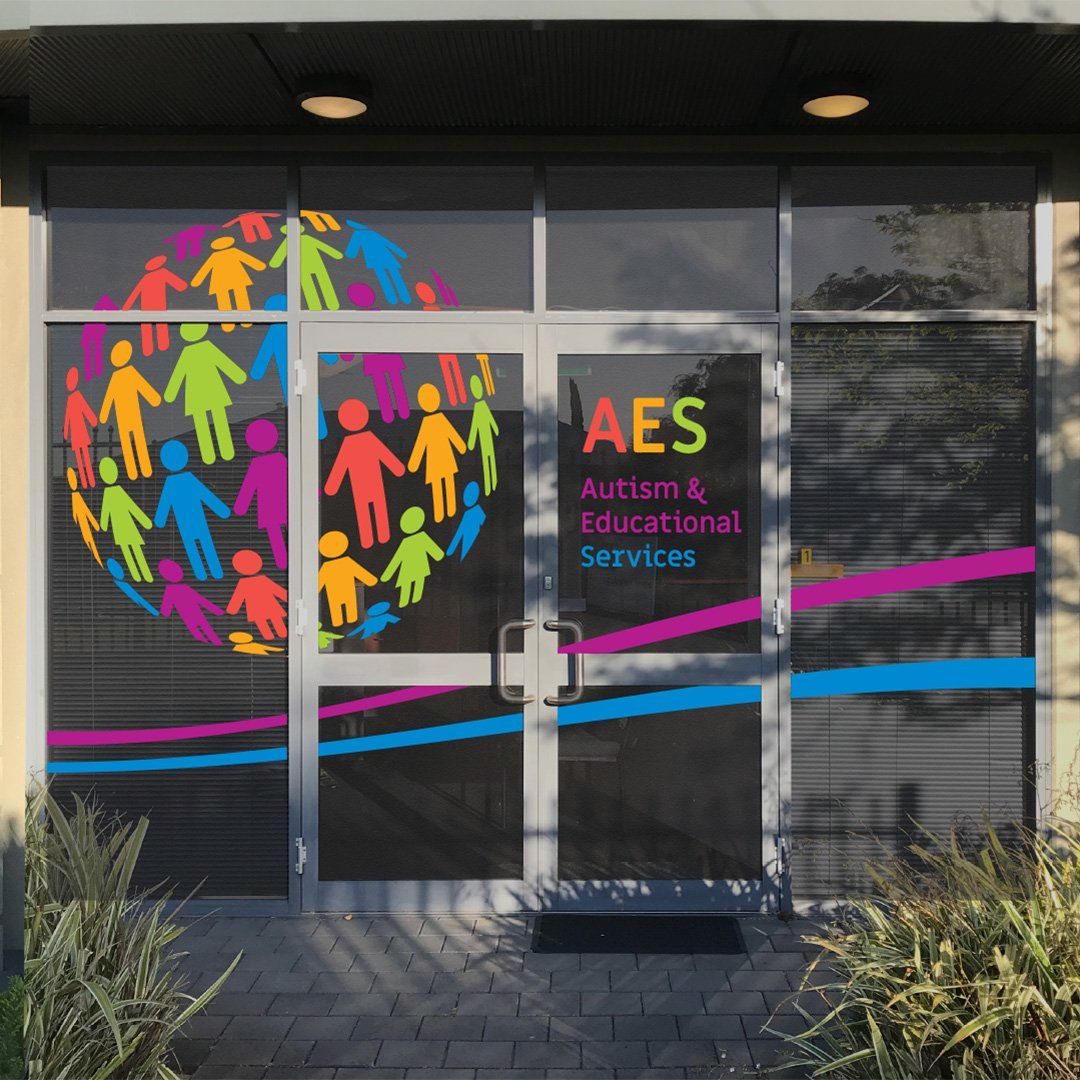 A building with a sign that says aes autism & educational services