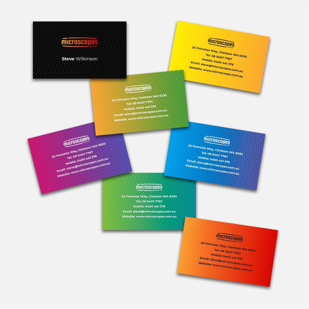 A bunch of colorful business cards are stacked on top of each other