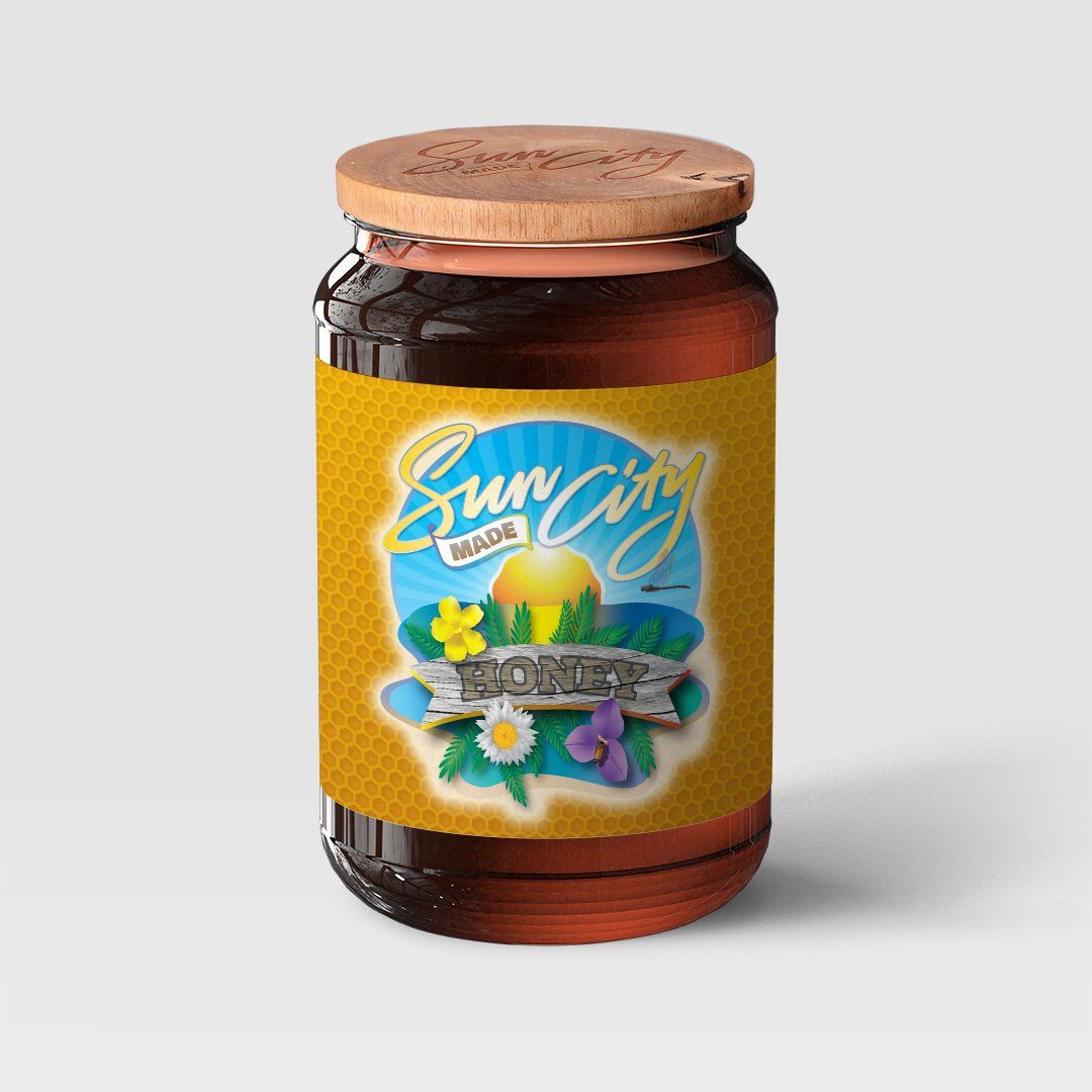 A jar of sun city honey with a wooden lid
