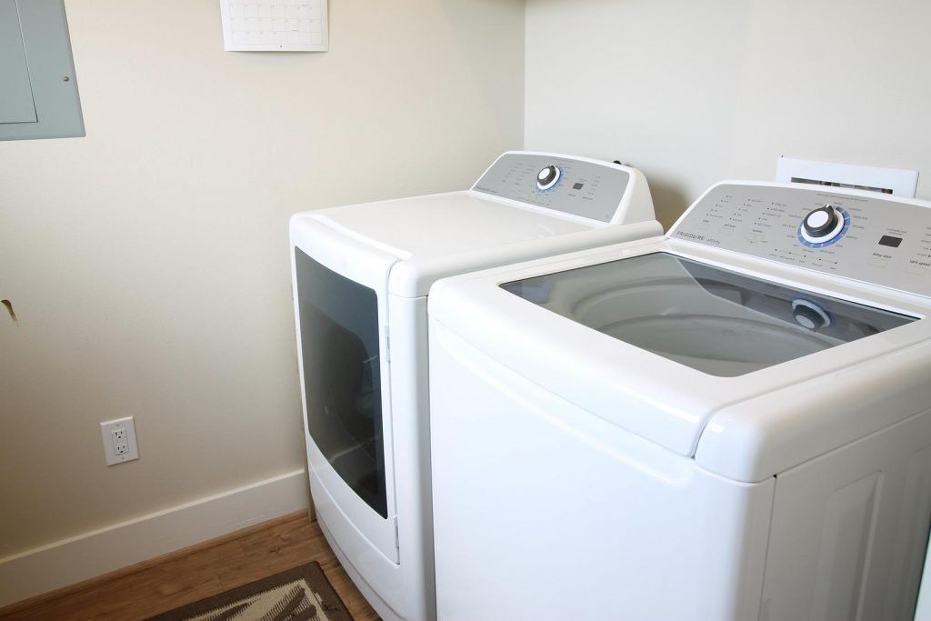 a laundry room with a washer and dryer in it .