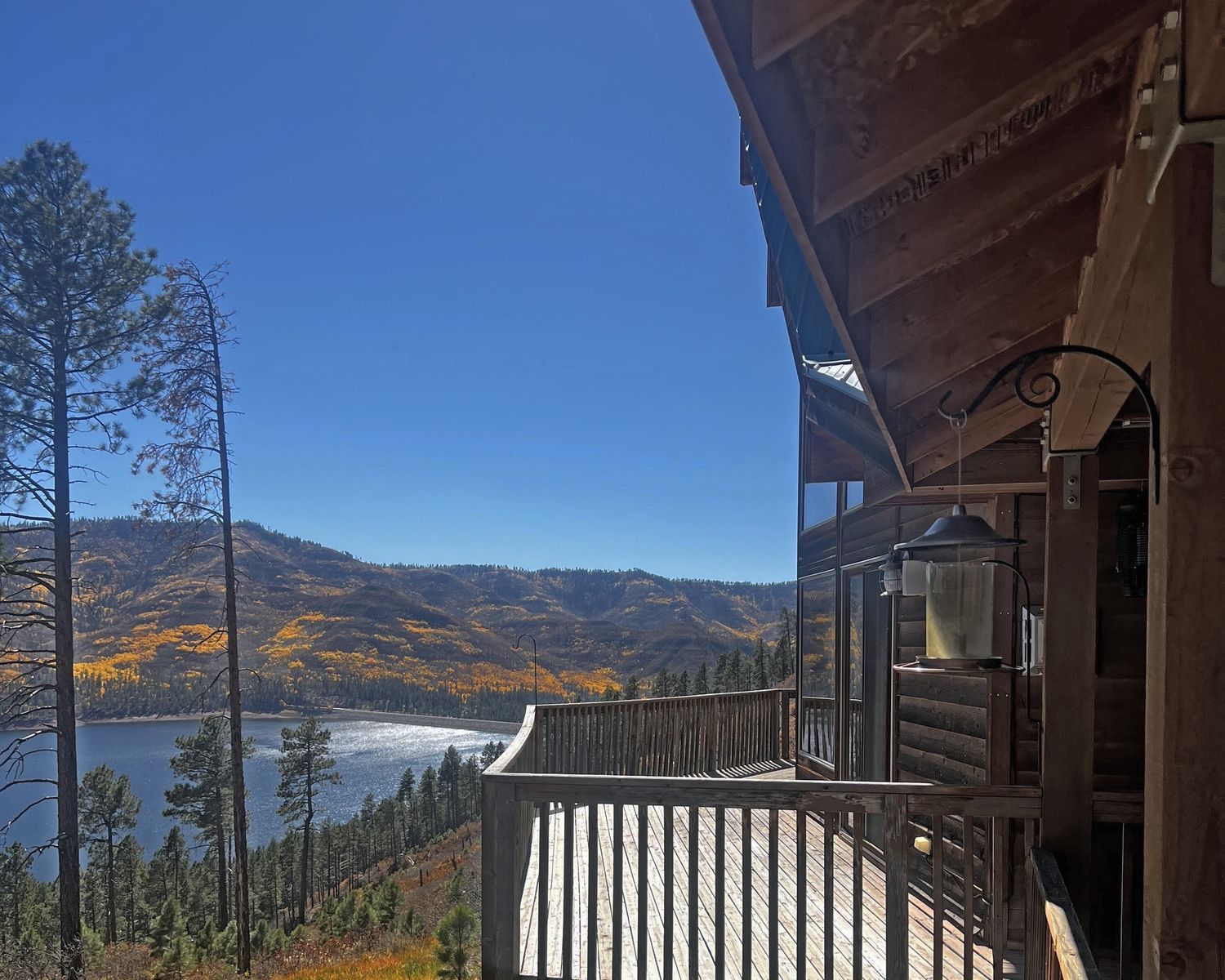 a balcony overlooking a lake and mountains