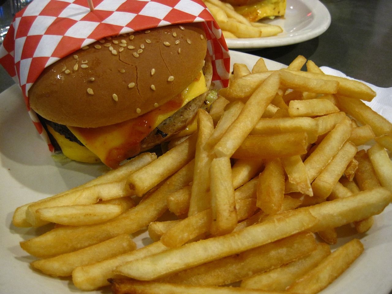 a hamburger and french fries on a plate