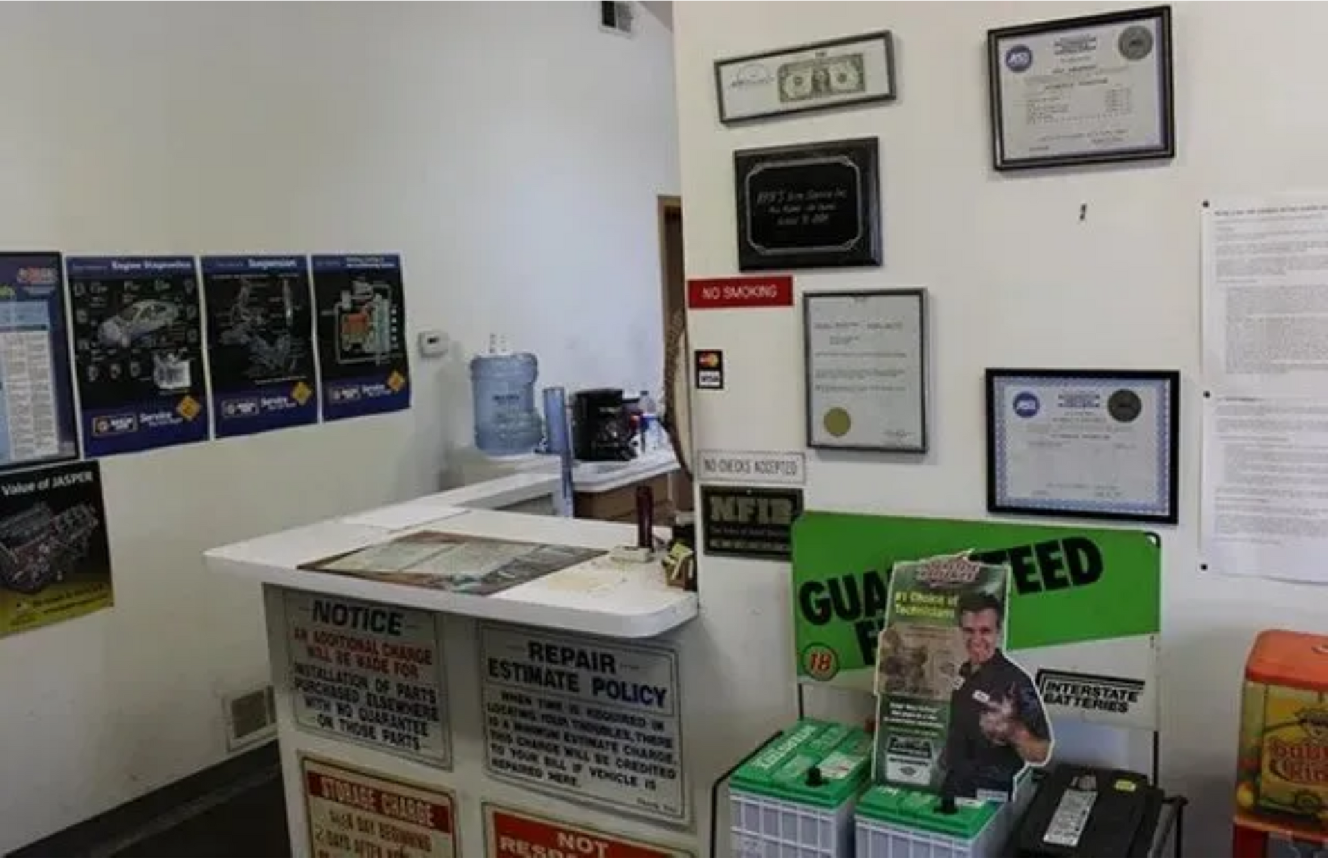 A man is standing in front of a counter with a sign that says notice