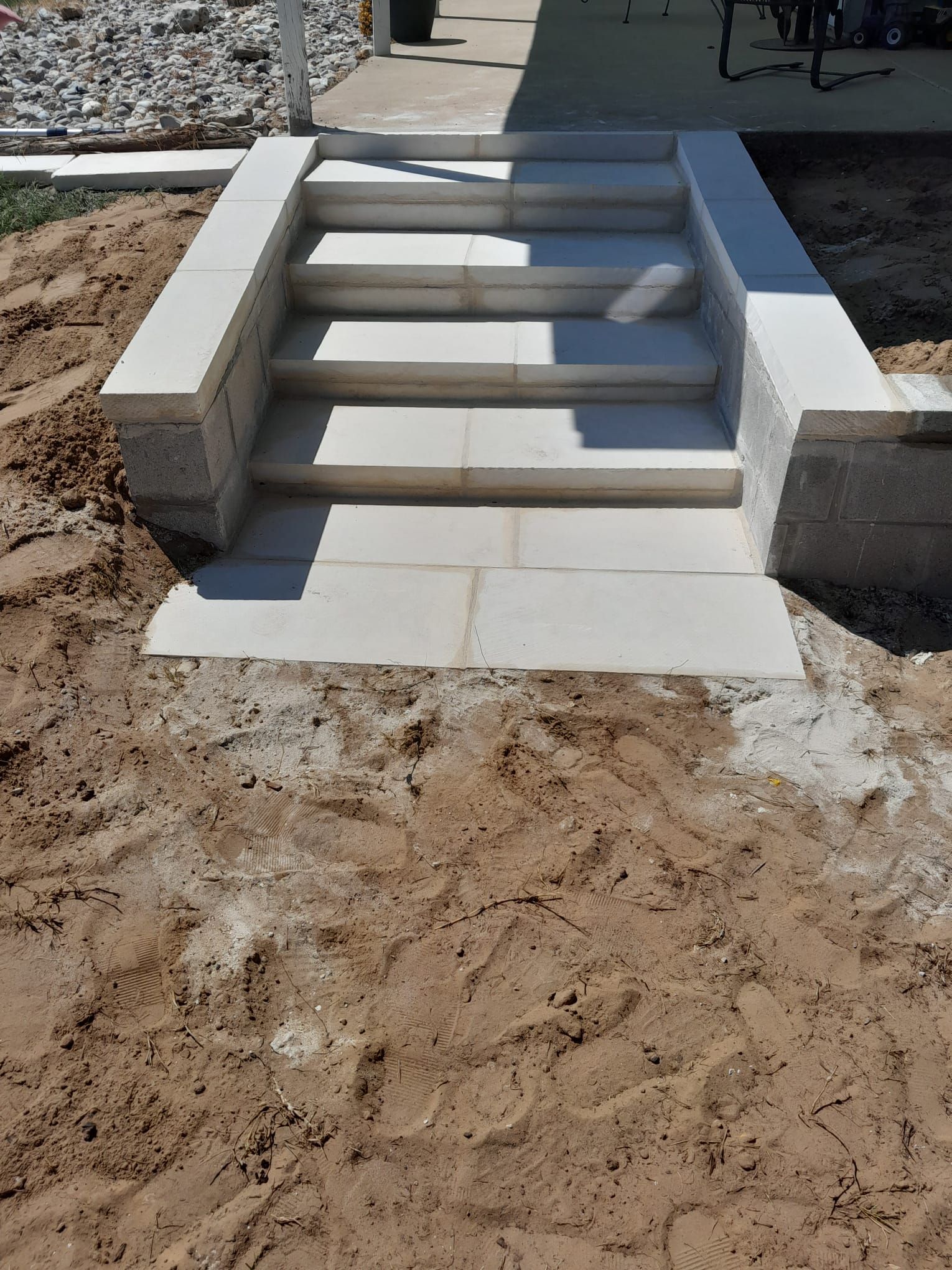 A set of stairs that are being built in the dirt.