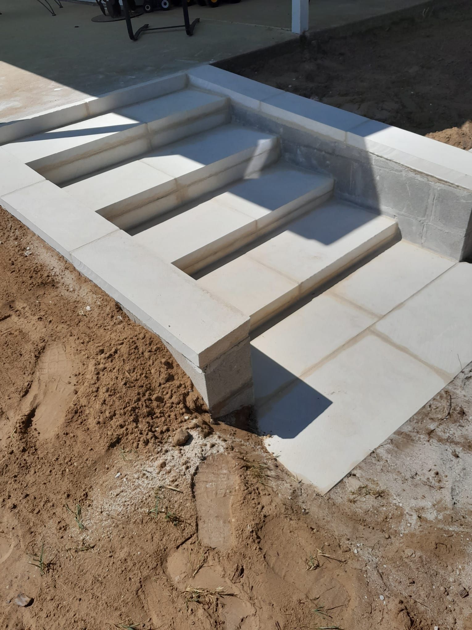 A set of stairs that are being built in the dirt