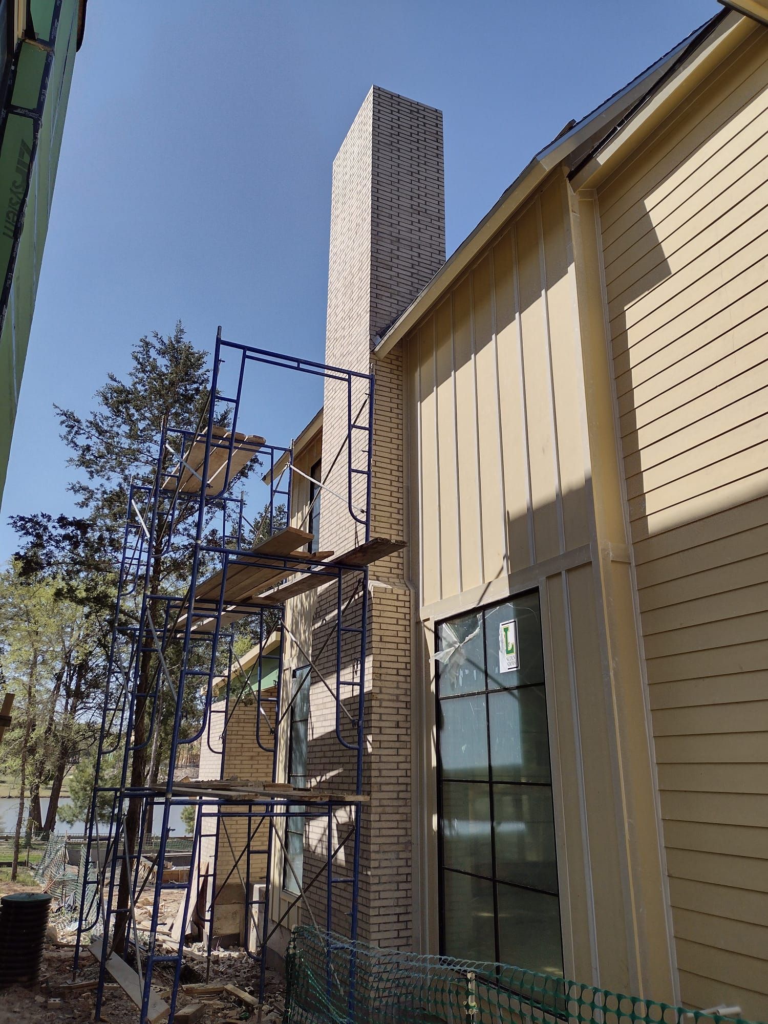 A building under construction with scaffolding on the side of it.