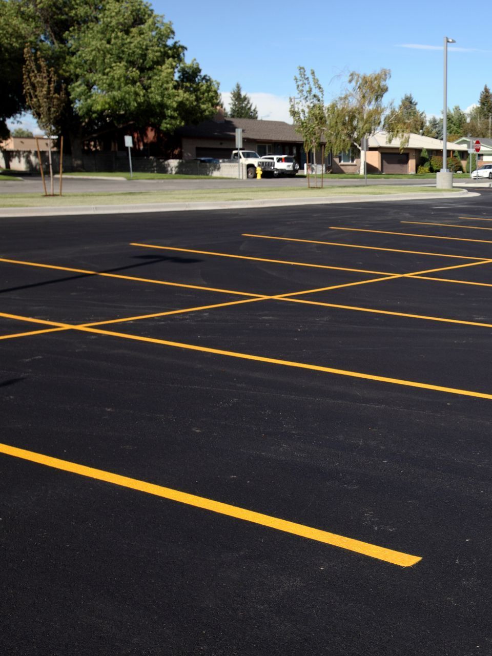 A parking lot with a yellow line in the middle