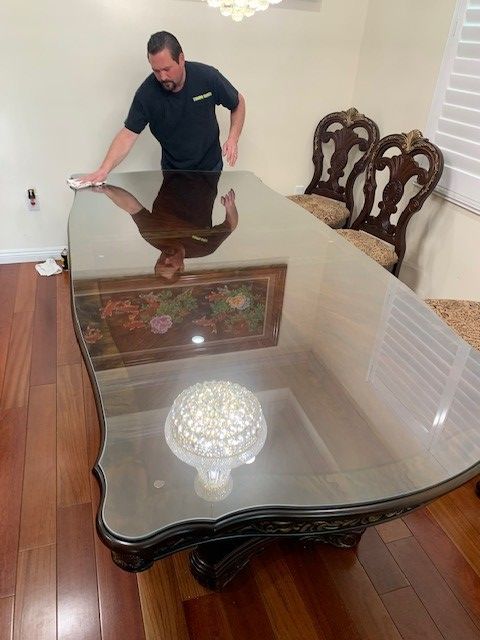 Man Cleaning The Glass Table - Reseda, CA - Tampa Glass Inc