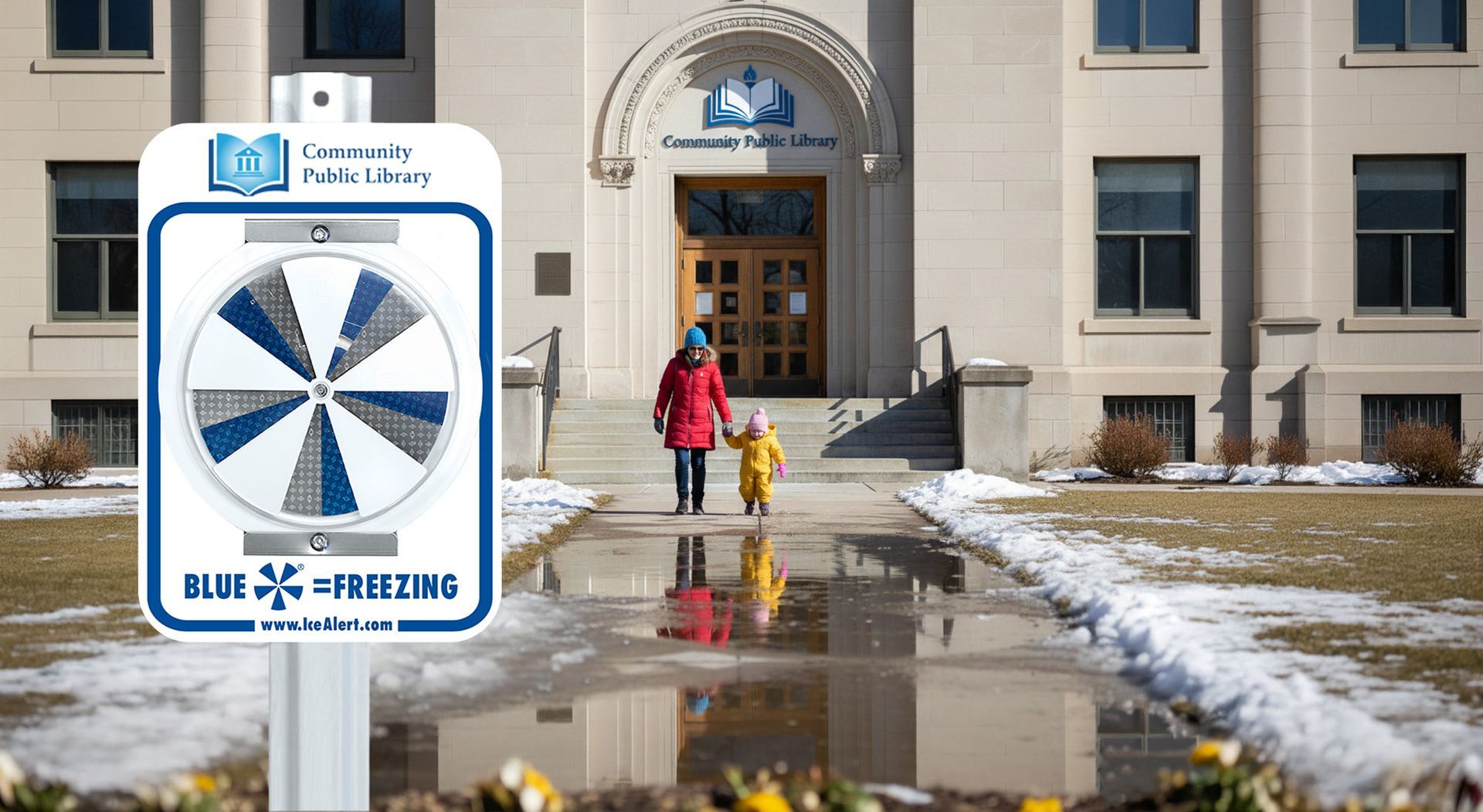 Two people walking in front of a library building with custom logo; an IceAlert sign displays a blue freezing indicator.