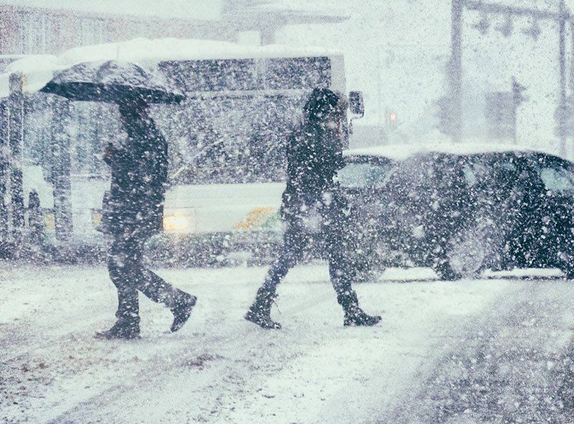 snowy blizzard with people walking