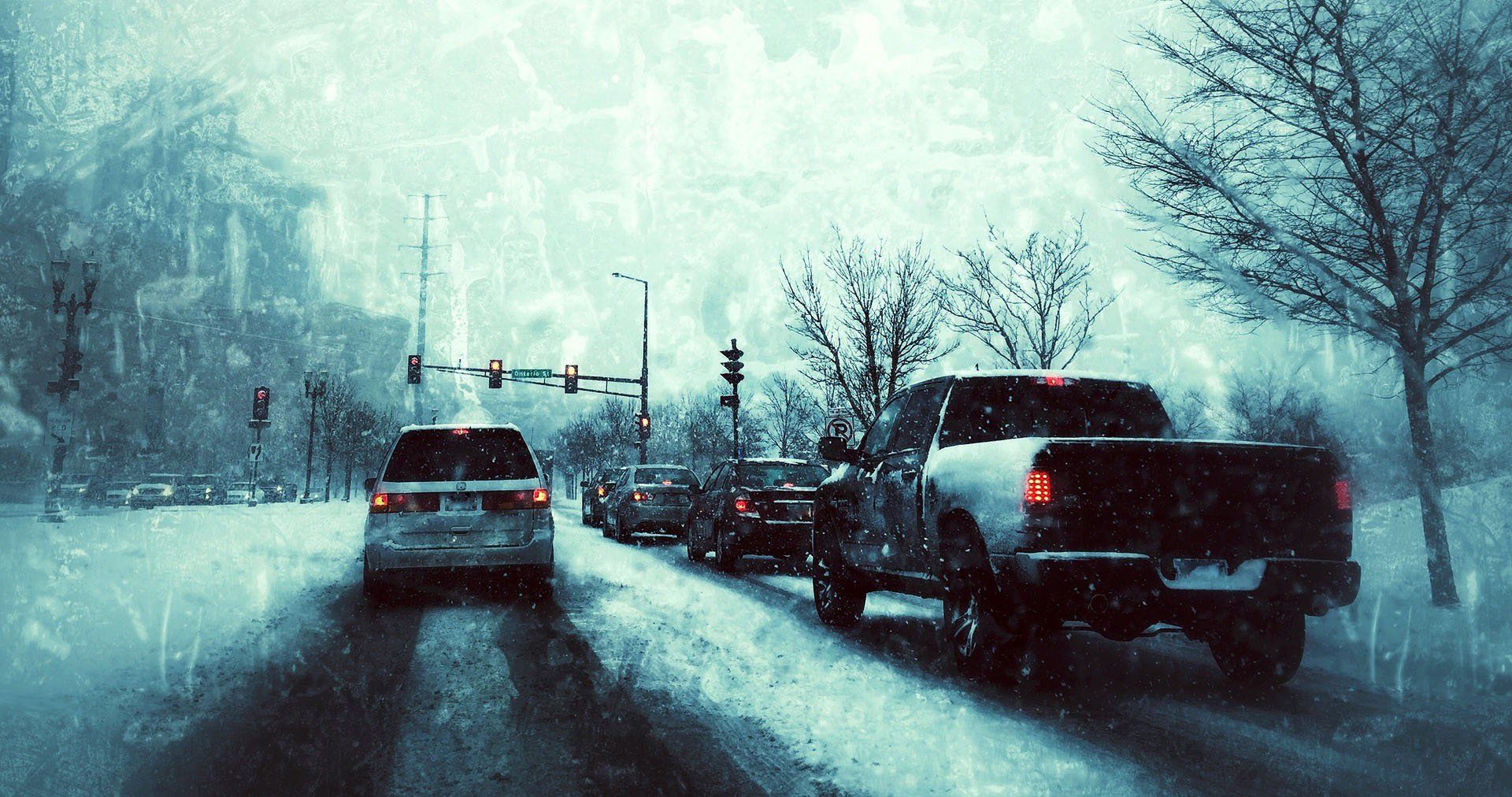 cars on a snowy roadway