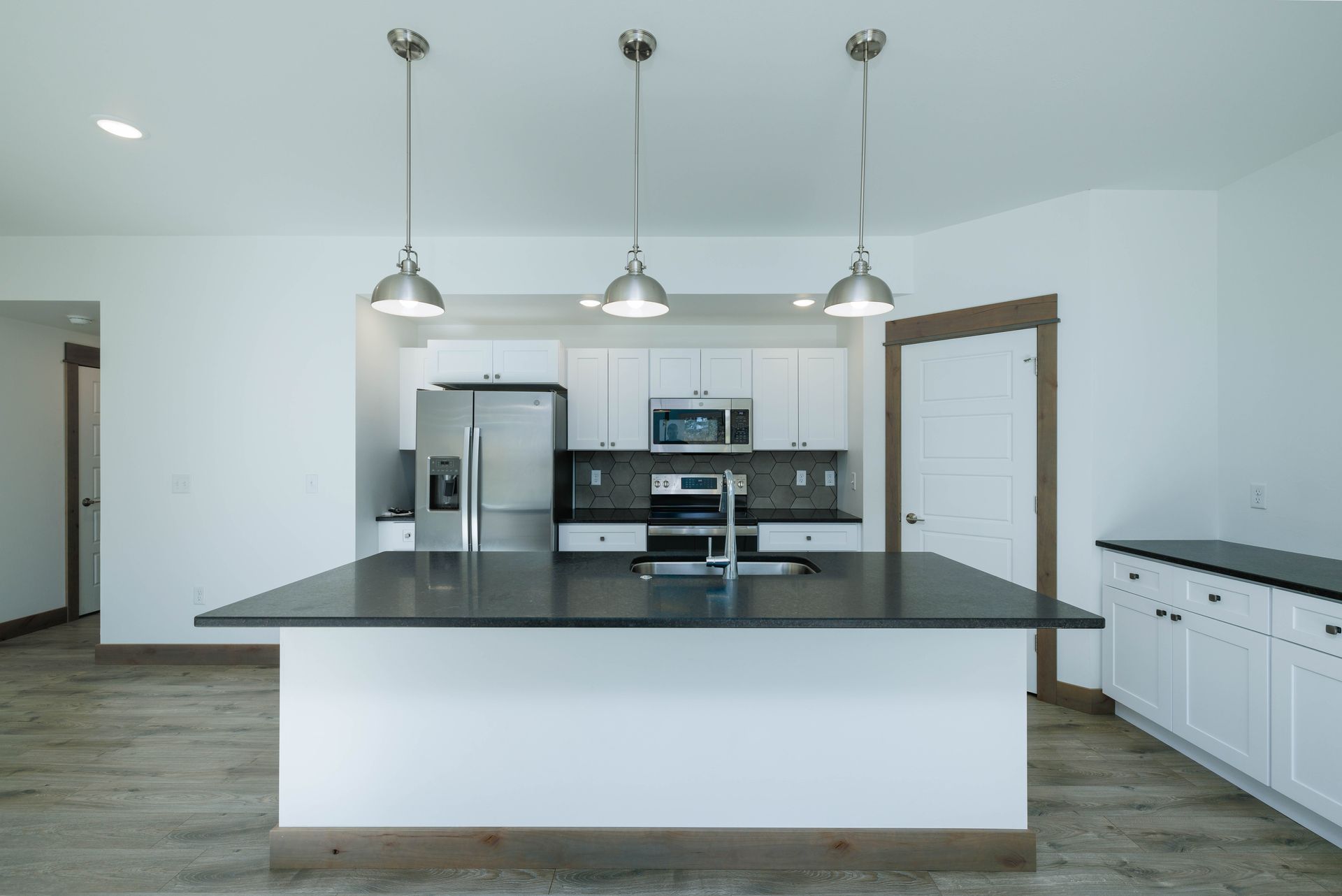There is a large island in the middle of the kitchen.