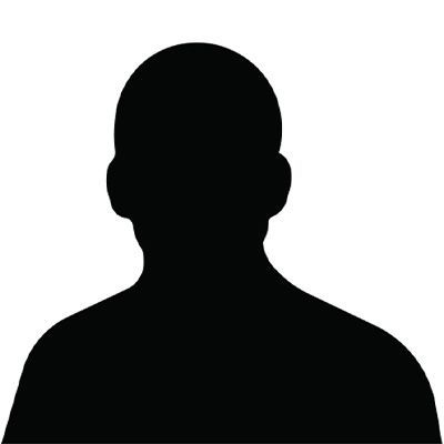 Man smiling, wearing a dark blue t-shirt, against a white background.