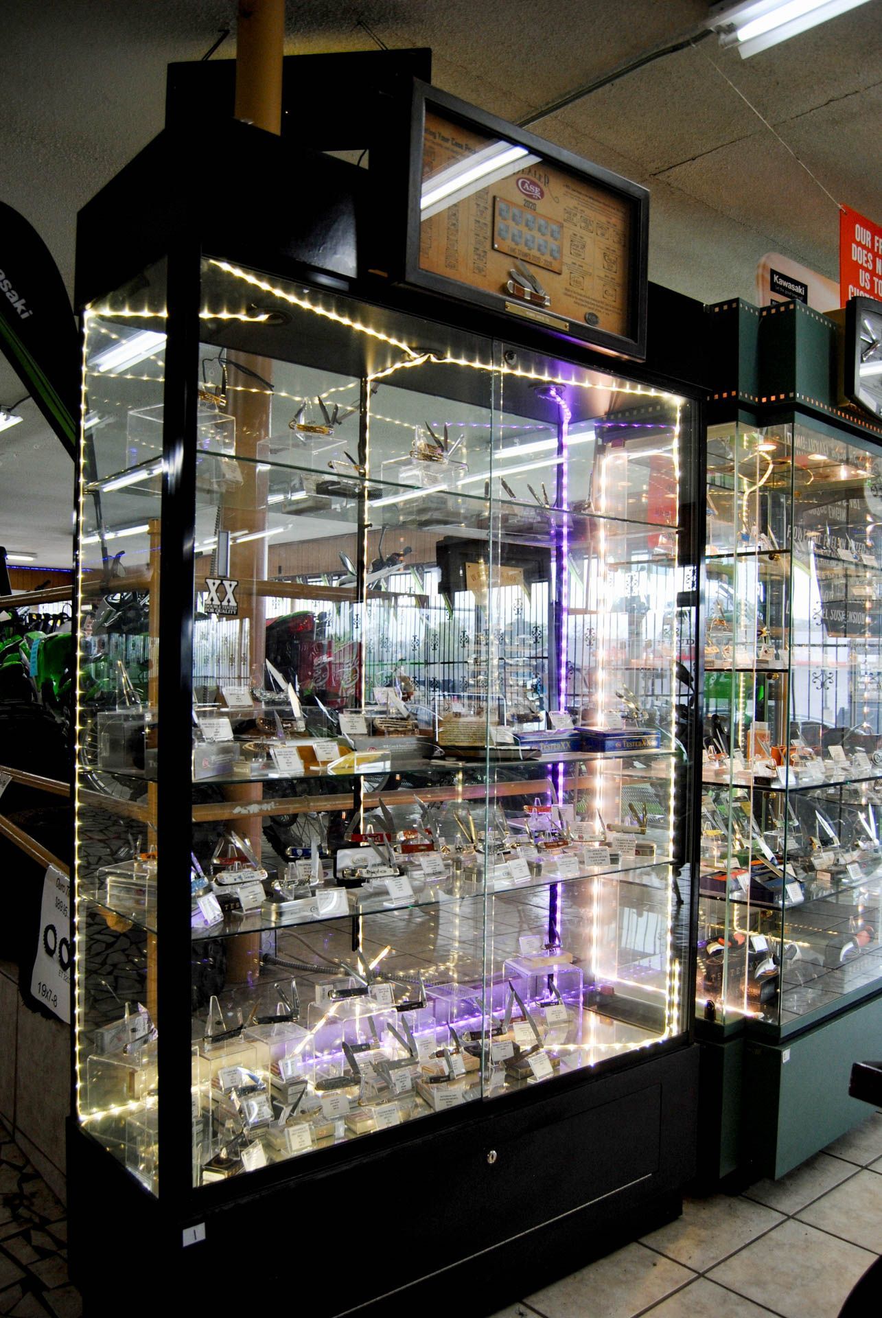 A display case filled with lots of items in a store.