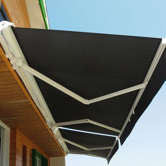 A black and white awning on the side of a building