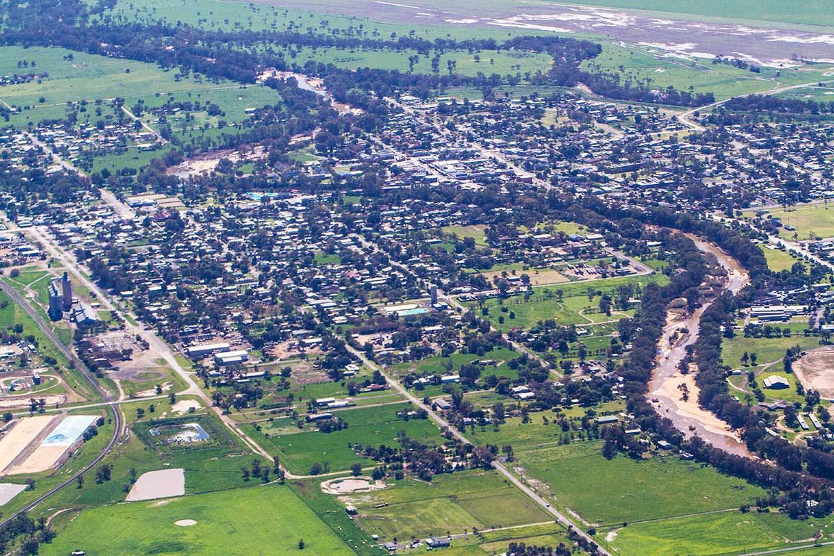 An Aerial View Of A Small Town With A River Running Through It — Gillies Enterprises Pty Ltd In Inverell, NSW