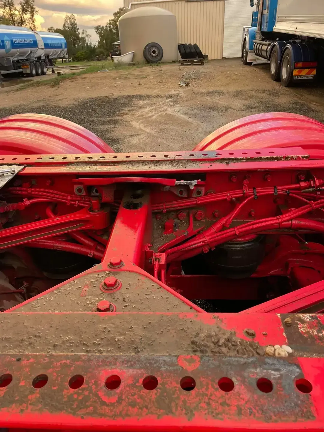 A red semi truck is parked in a dirt lot. — Gillies Enterprises Pty Ltd In Narrabri, NSW