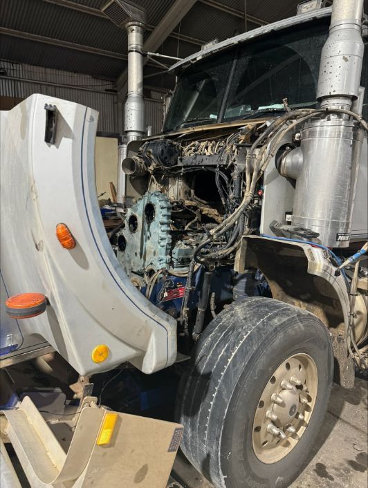 A Truck With Its Hood Open Is Sitting In A Garage — Gillies Enterprises Pty Ltd In Narrabri, NSW