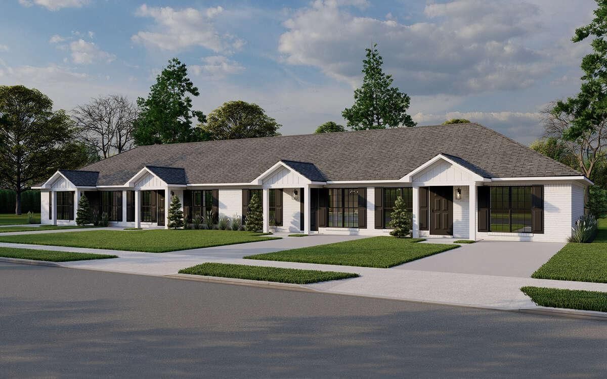 Single-story row of white townhouses with blue roofs and front porches beside a driveway and lawn.