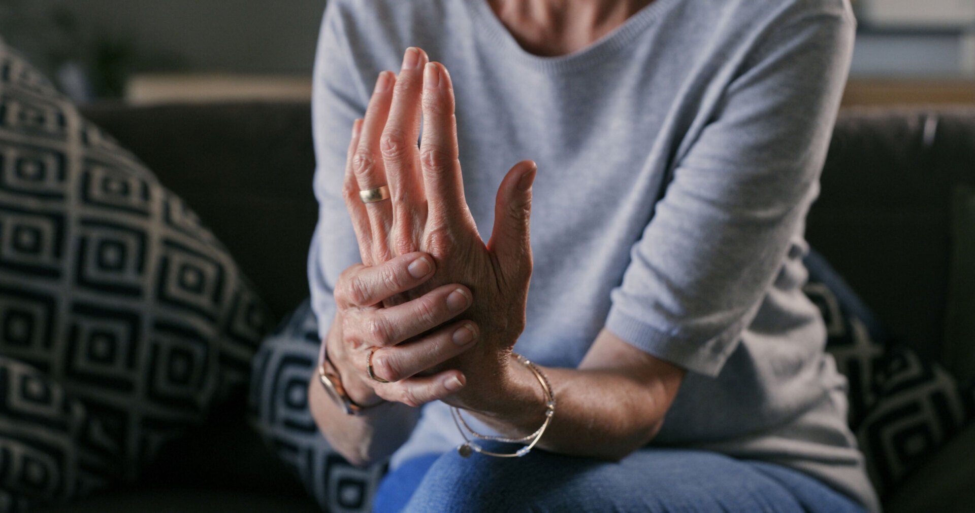 a woman with a ring on her finger is holding her hand