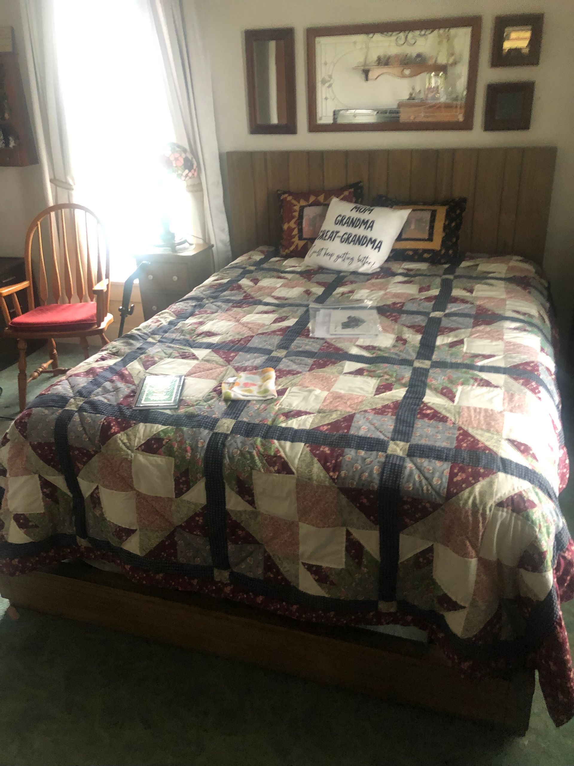 Bedroom with wooden furniture and wall decor — Sheffield, IL — Johnson Agency