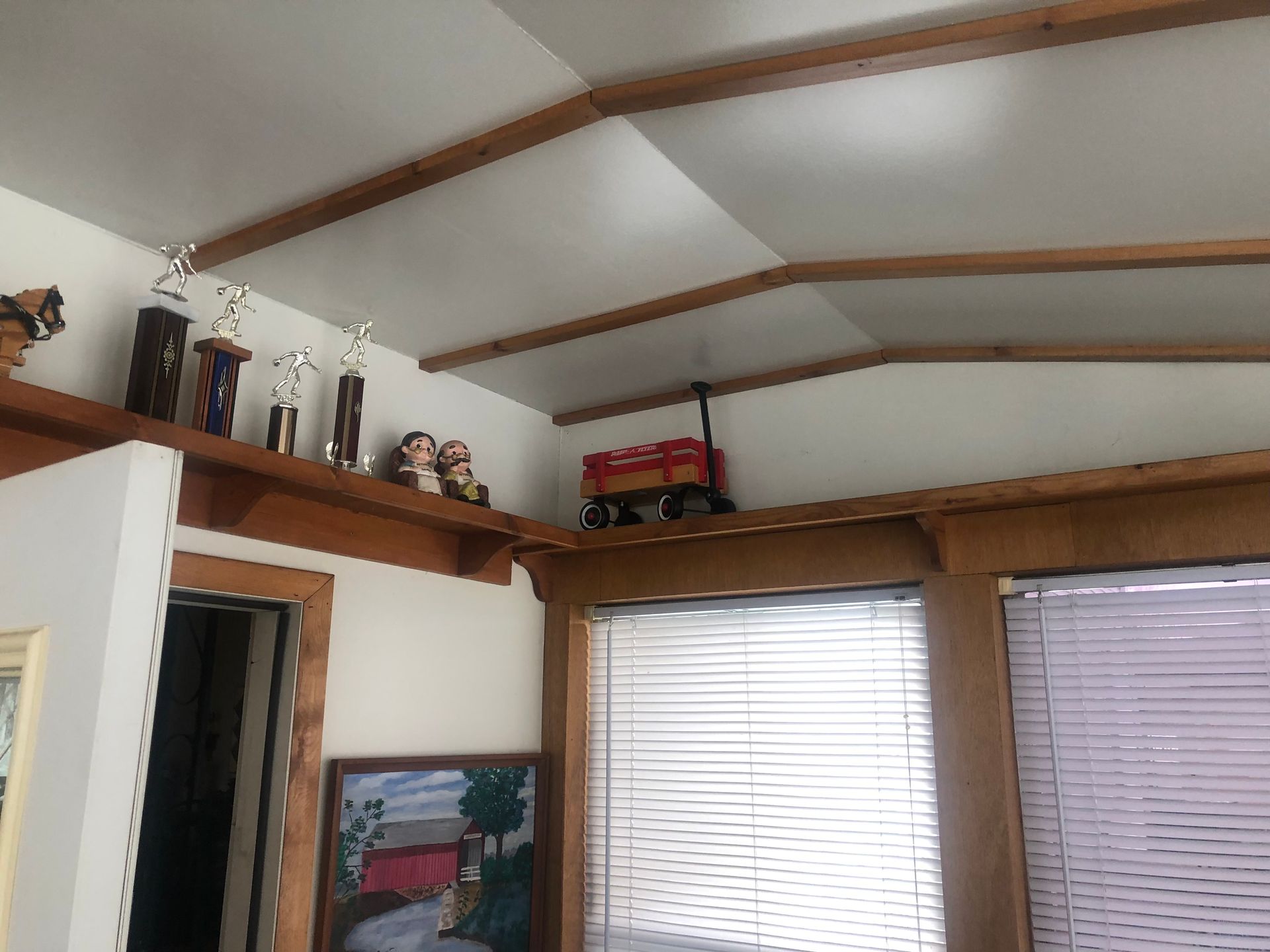 Living room corner with wooden beams and decor — Sheffield, IL — Johnson Agency