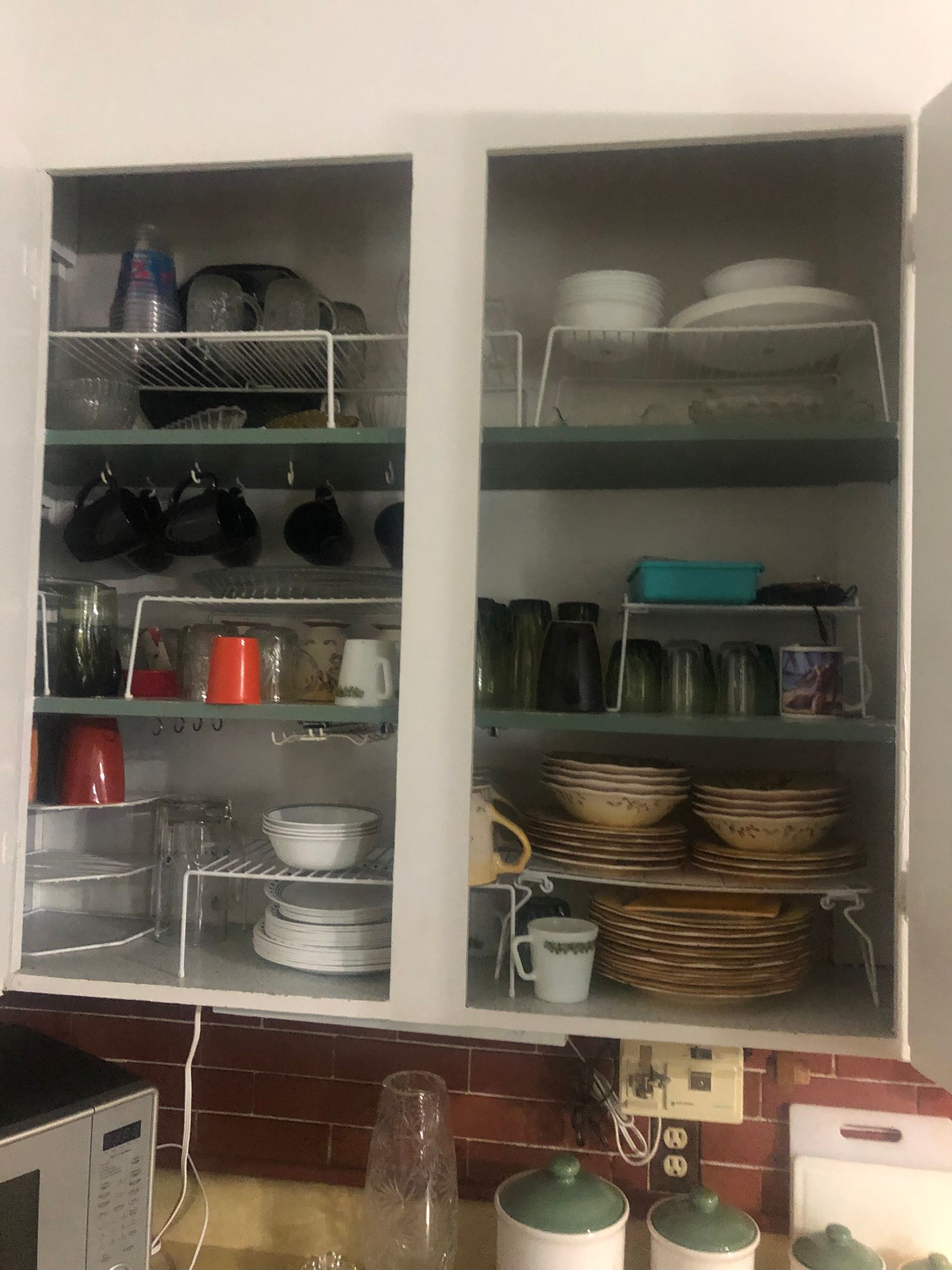 Kitchen cabinet with dishes and glassware — Sheffield, IL — Johnson Agency