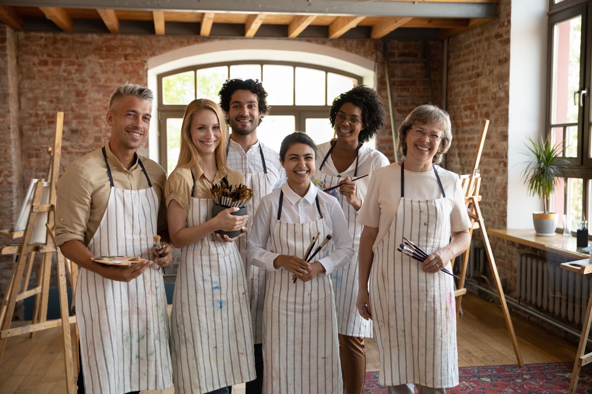 The eldery white woman with the rest of her painting class, she's decided to work with a life coach