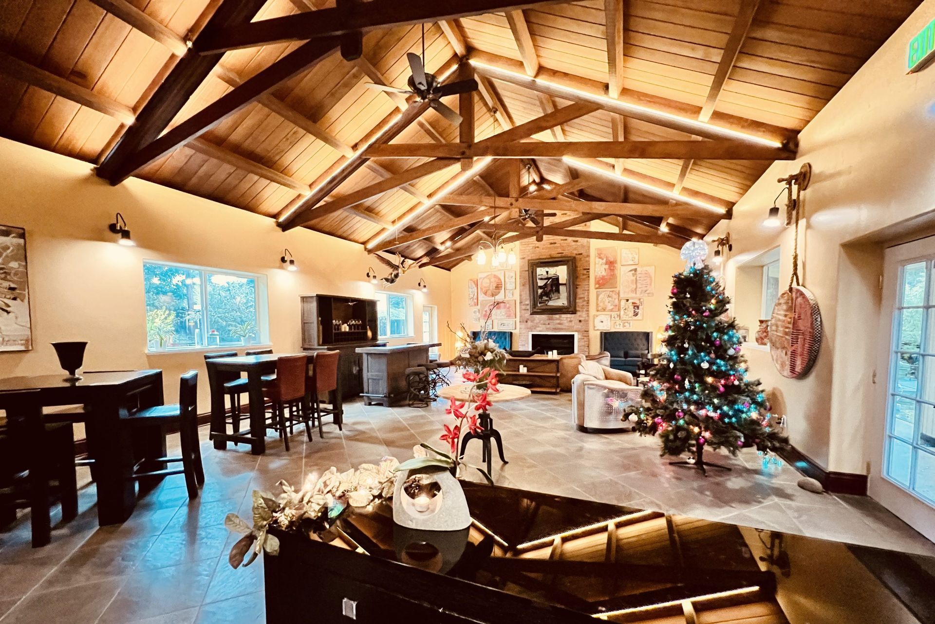 There is a christmas tree in the middle of the room.