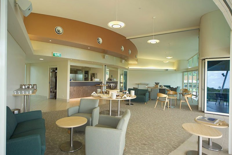 A large room with tables and chairs in it