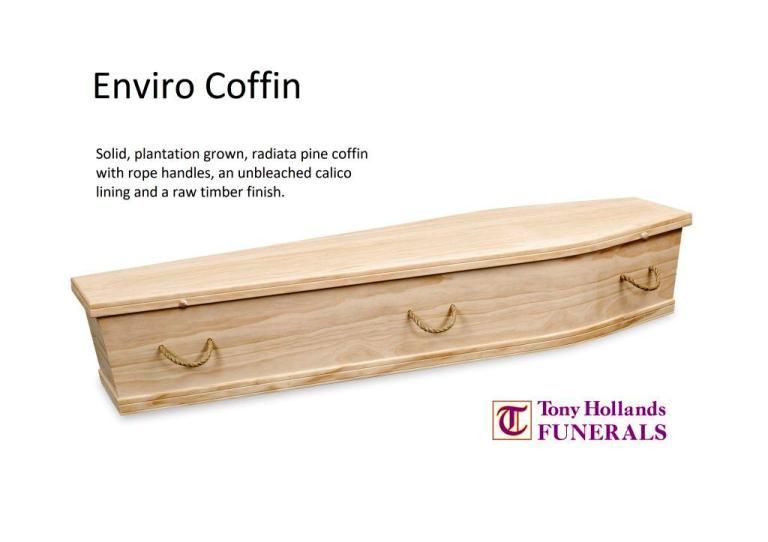 A wooden coffin with rope handles is on a white background.