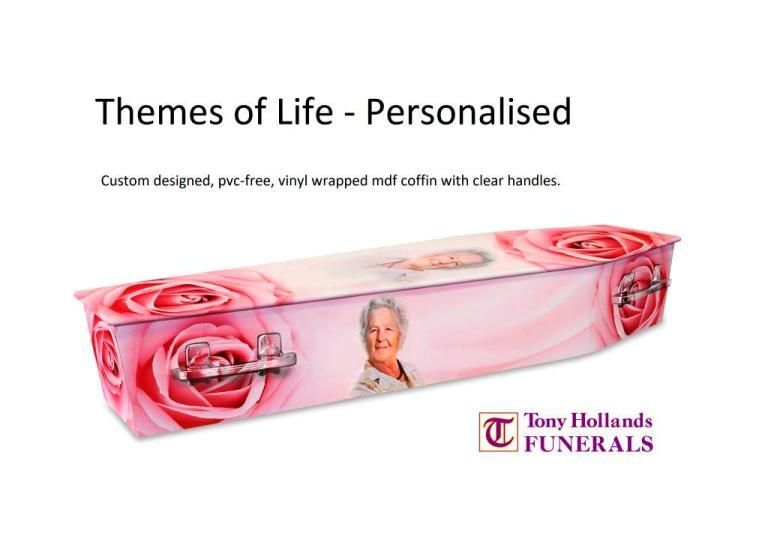 A pink coffin with a picture of a woman on it